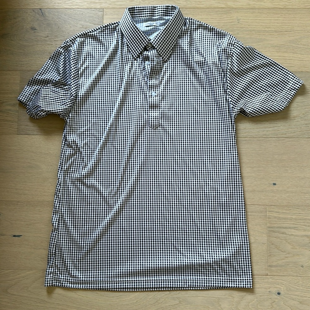 Men’s black and white collars and co. polo shirt.